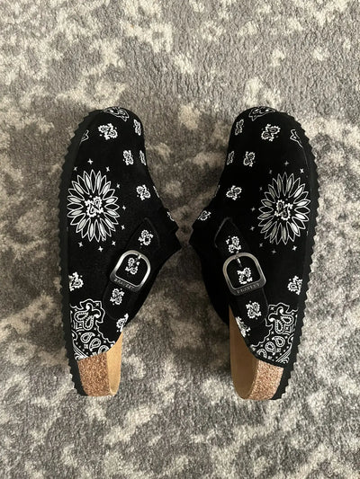 Customer relaxing wearing Cloggs